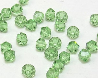 Swarovski Crystal 4mm Bicones, 24 Peridot Green Beads, Item 153B