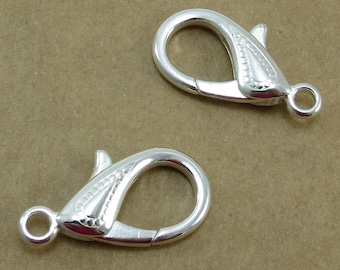Hummerspännen, Fyra (4) 25 x 15 mm Dubbelsidiga Silver Droppformade Spännen, Artikel 1002 m