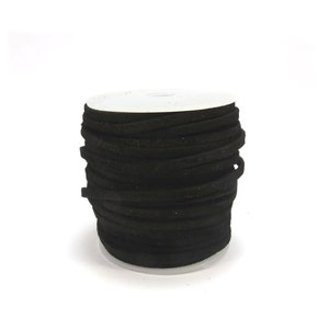 May include: A spool of black suede cord, wound tightly and ready for crafting projects.