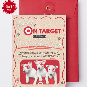 May include: A 5x7 inch greeting card with a kraft paper background, featuring the text "You're ON TARGET FOR A Great School Year" and "Here's a little something to help you start it off RIGHT!" with three white puppies in a red shopping cart.