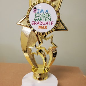 Pre-K, Kindergarten, or First Grade graduate trophy, with your NAME on the front, about 8" tall, add your engraving