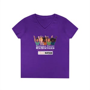 May include: A purple V-neck t-shirt featuring a graphic of diverse women with raised arms. The text on the shirt reads "TEMECULA VALLEY RESISTERS Empowered Women Empower Women" and "Trouble NATION" in a white rectangle.