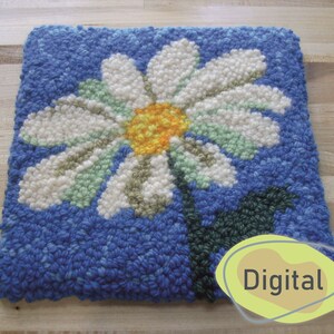 Peut inclure: Un tapis bleu et blanc avec une marguerite blanche au centre jaune. Le tapis est fait de laine et a une surface texturée. Le mot "Digital" est écrit en jaune sur un ovale jaune.