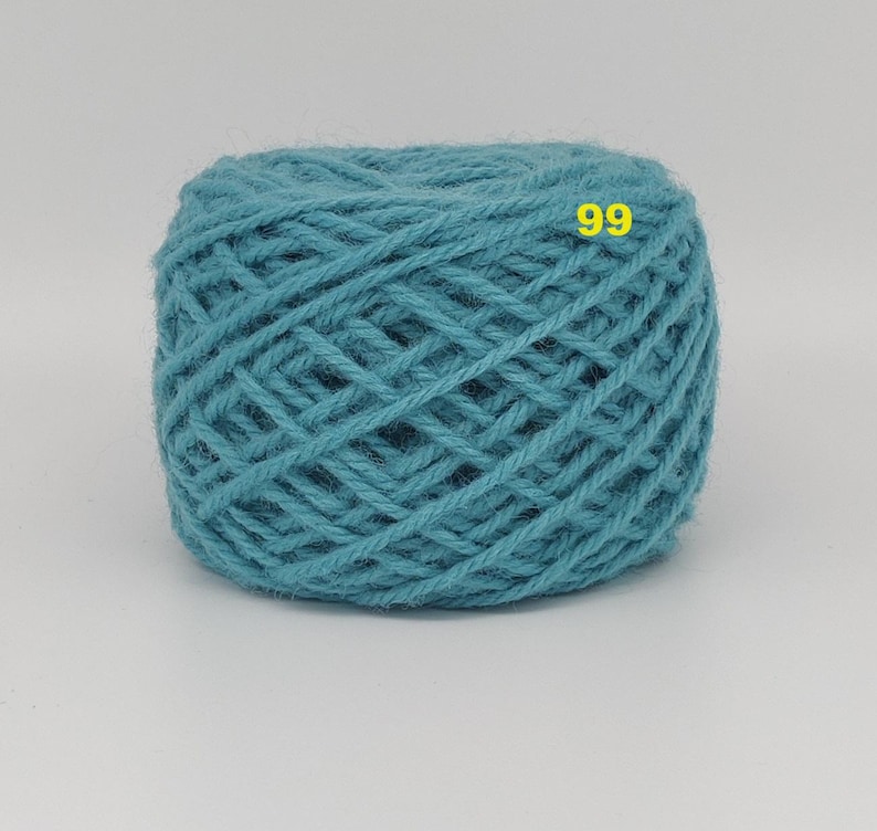 May include: A ball of teal yarn with a woven texture. The yarn is a solid color and has the number "99" in yellow on the surface. This yarn is suitable for knitting and crocheting projects.