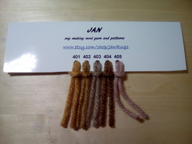 May include: A card with five yarn samples in different shades of brown, beige, and pink. The card is labeled "JAN rug making wool yarn and patterns www.etsy.com/shop/JanRugs 401 402 403 404 405"