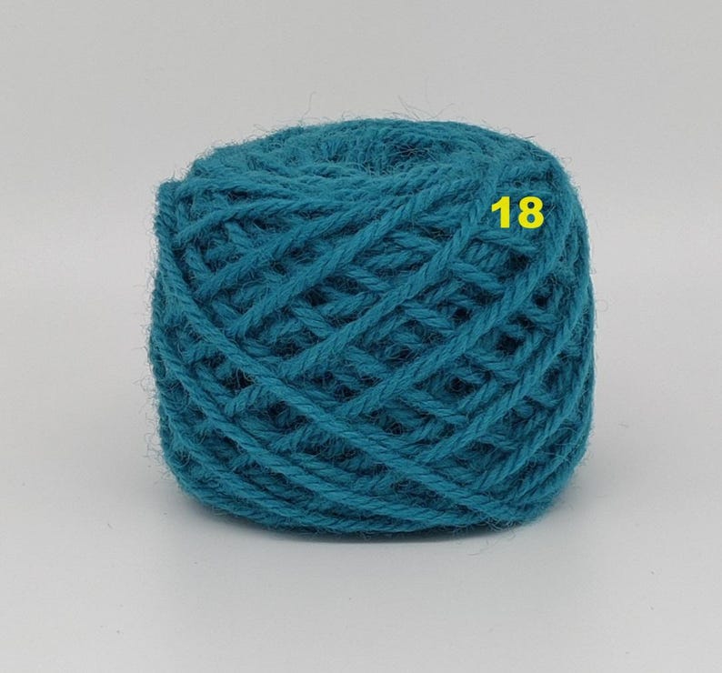 May include: A ball of teal yarn with a woven texture. The number "18" is printed in yellow on the yarn. This yarn is suitable for knitting, crocheting, and other fiber crafts.