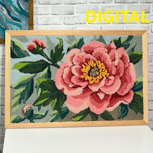 Peut inclure: Une œuvre d'art en point d'aiguille encadrée représentant une grande pivoine rose avec un centre jaune, entourée de feuilles vertes sur un fond gris clair. Le cadre est en bois naturel.