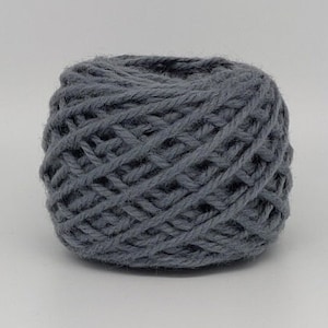 May include: A skein of gray yarn, perfect for knitting or crocheting projects.