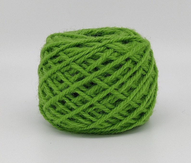 May include: A ball of bright green yarn, perfect for knitting or crocheting.