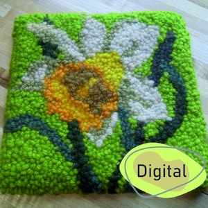 Peut inclure: Un tapis en laine piquée de couleur verte, blanche, jaune et marron avec un motif floral. Le tapis porte l'inscription "Digital" dans un cercle jaune en bas à droite.