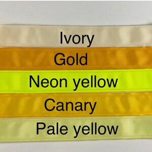 Five different colors of ribbon, from top to bottom: ivory, gold, neon yellow, canary yellow, and pale yellow.