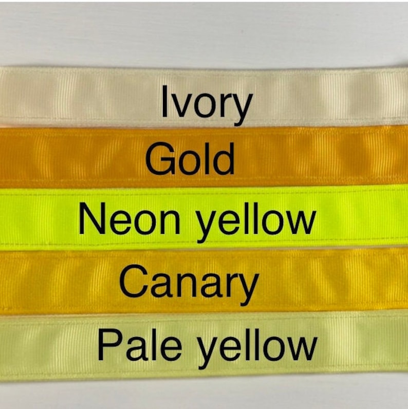 Five different colors of ribbon, from top to bottom: ivory, gold, neon yellow, canary yellow, and pale yellow.