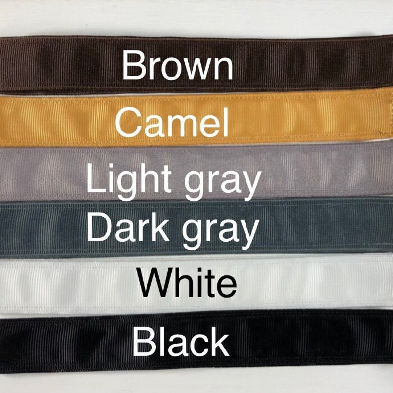 Six different colors of ribbon, from top to bottom: brown, camel, light gray, dark gray, white, and black.