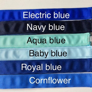 Six different shades of blue ribbon, from left to right: electric blue, navy blue, aqua blue, baby blue, royal blue, and cornflower blue.
