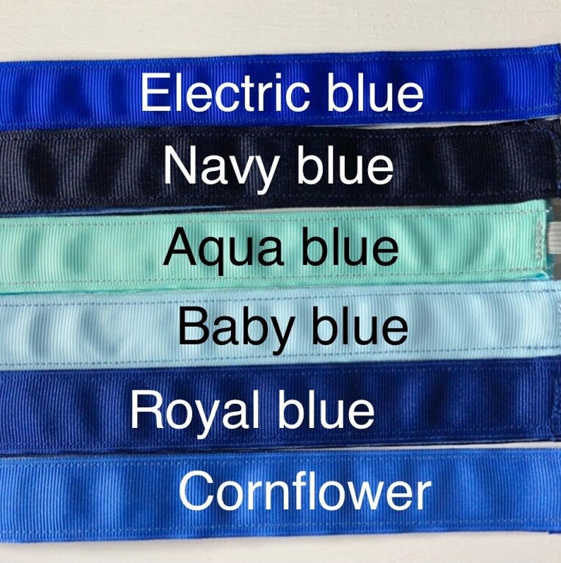 Six different shades of blue ribbon, from left to right: electric blue, navy blue, aqua blue, baby blue, royal blue, and cornflower blue.