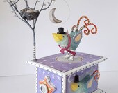 Papier mache box, bird sculpture. Bird with warm scarf, nest, egg, and winter tree in a winter scene. Handmade home decor