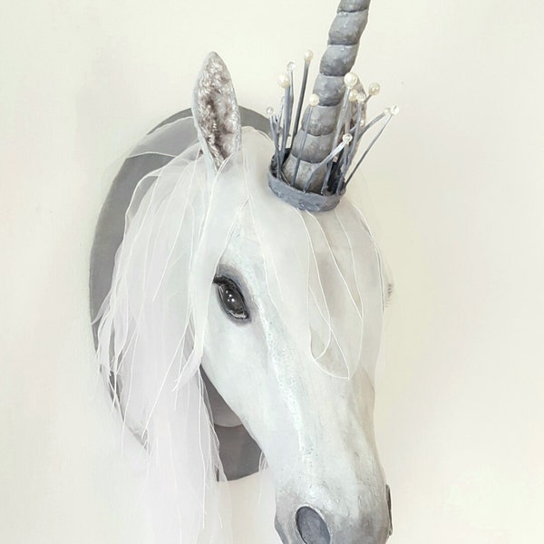 Fauxidermy unicorn head, life-size, jewelled crown, handmade mixed media sculpture, wall-mounted trophy head, statement piece.