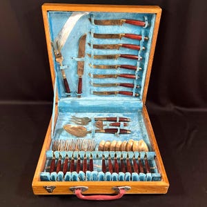 28 Piece Set of E. Man Jewelry Factory Flatware, Brass and Wood, 8 Knives, 7 Forks, 8 Spoons, Plus 5 Serving Pieces, Case is Missing 1 Latch
