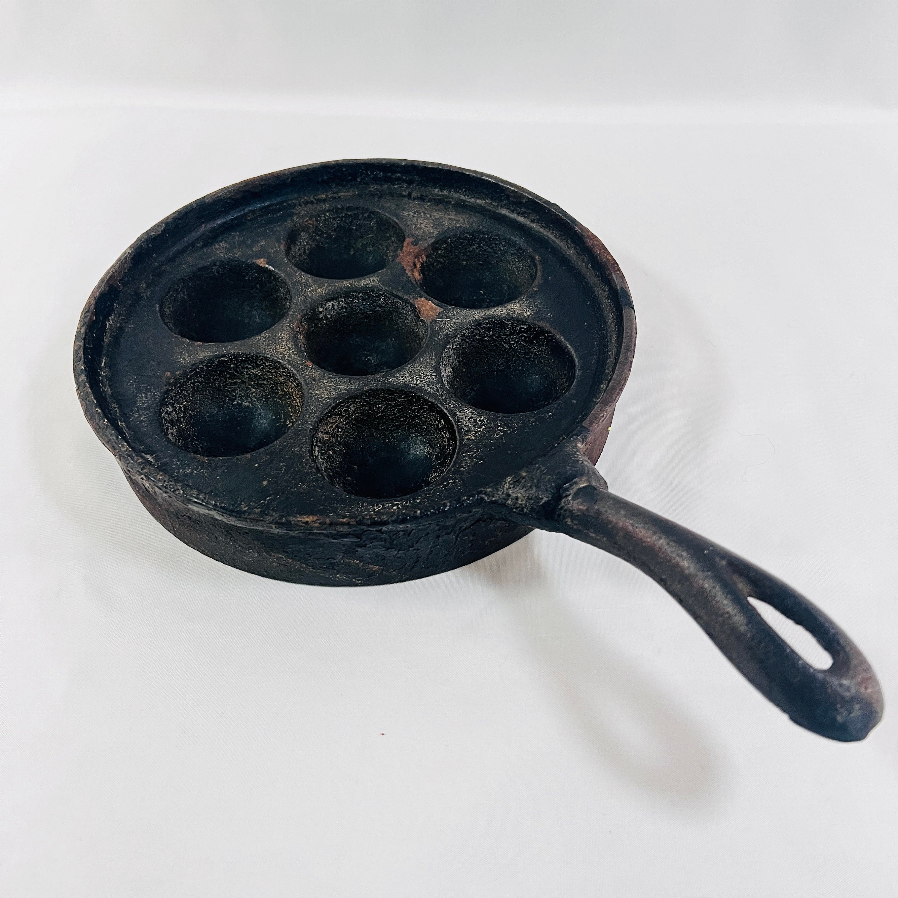 Aebleskiver pan being used. Griswold cast iron. Induction stovetop