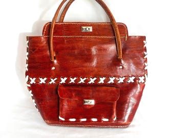 A Unique Leather Purse with Bold Criss Cross Stitching, Front Pocket, Double Handles in Good Used Condition with Some Ware