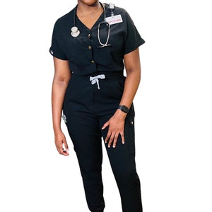 Black jumpsuit scrub with front button and jogger leg