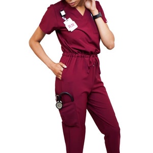 Burgundy jumpsuit scrub soft stretch fabric. Runs big. Has Zipper at the crotch for bathroom break. Also at www.Jocciniscrubs.com