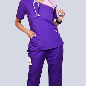 Purple Dual Tone Nursing Scrub Set non-stretch fabric. On sale now. (No returns on these pls) sales are final. Also at www.Jocciniscrubs.com