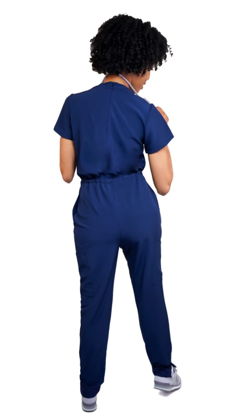 Navy blue jumpsuit scrub soft stretch fabric. Has Zipper at the crotch for bathroom. Also at www.Jocciniscrubs.com image 3