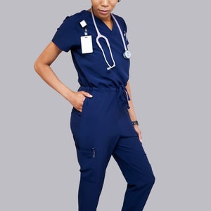 Navy blue jumpsuit scrub soft stretch fabric. Has Zipper at the crotch for bathroom. Also at www.Jocciniscrubs.com image 2