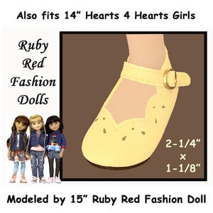 May include: Yellow leather doll shoes with a strap and buckle. The shoes are 2-1/4 inches by 1-1/8 inches. The shoes are modeled by a 15 inch Ruby Red Fashion Doll. Also fits 14 inch Hearts 4 Hearts Girls.