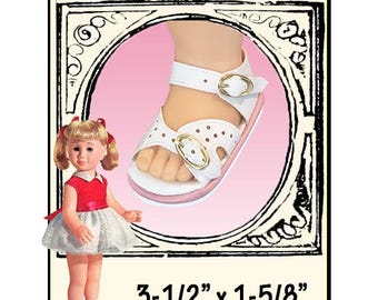 May include: A white doll sandal with gold-tone buckles, a pink sole, and perforated details. The sandal measures 3-1/2 inches by 1-5/8 inches. A blonde doll wearing a red and white dress is shown alongside the sandal, labeled Modeled by Chatty Cathy.