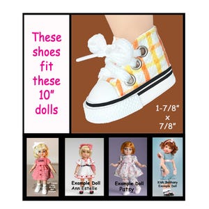 May include: A high-top doll sneaker with a white, yellow, and orange plaid pattern, white laces, and a white rubber sole. Text states: These shoes fit these 10" dolls, 1-7/8" x 7/8". Four example dolls are shown: Linda McCall, Ann Estelle, Patsy, and Kish Bethany.