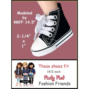 May include: A black high-top canvas sneaker with white laces, a white rubber toe cap, and a white sole with black trim. The shoe measures 2-1/4 inches by 1 inch and is modeled by RRFF 14.5 inch dolls, specifically Ruby Red Fashion Friends.