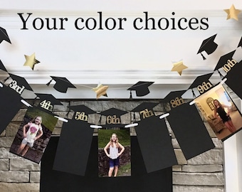 May include: A graduation photo banner with black photo frames, gold star accents, and graduation cap cutouts. The banner displays photos and grade levels from 1st to 12th grade. Text on the banner reads "Your color choices".
