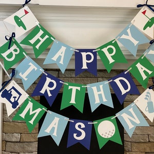 May include: A green, blue, and white banner with the words "Happy Birthday Mason" and golf-themed decorations.