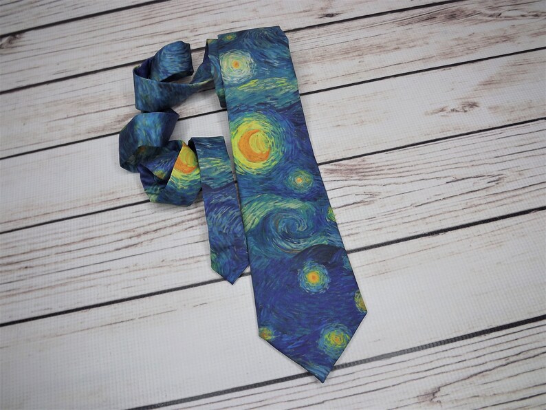 May include: A blue silk tie with a print of Van Gogh's Starry Night.