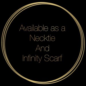 May include: Gold circle with the text "Available as a Necktie And Infinity Scarf" on a black background.