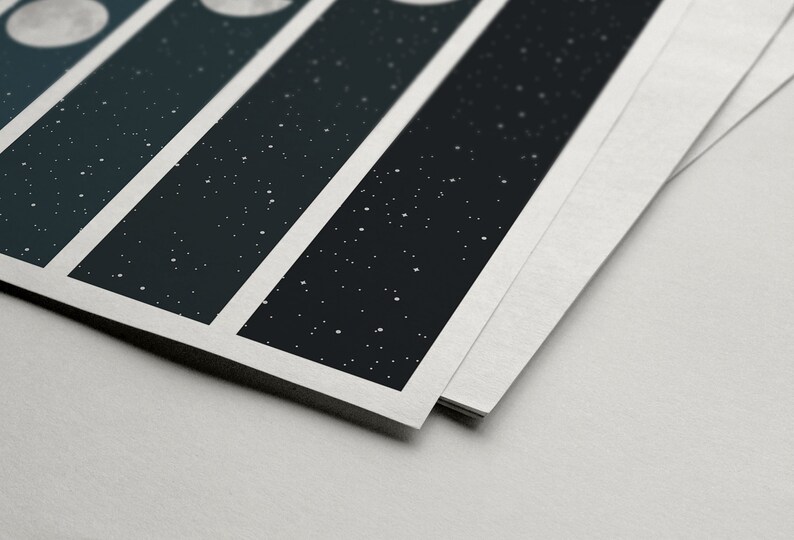 May include: Close-up of a stack of printed cards with a white border. Each card features a black background with white dots and a white circle in the top left corner.