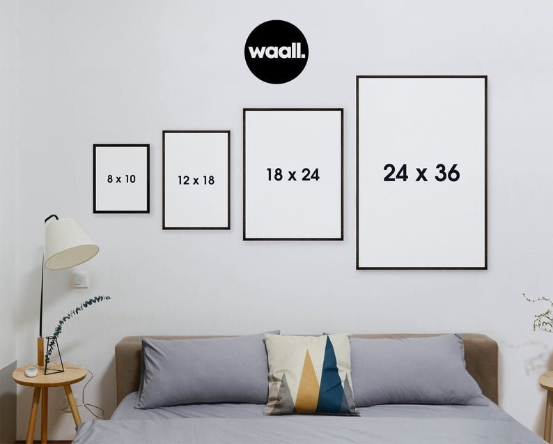 May include: Four black picture frames with white mats and white text showing different sizes: 8 x 10 inches, 12 x 18 inches, 18 x 24 inches, and 24 x 36 inches. The frames are hanging on a white wall.