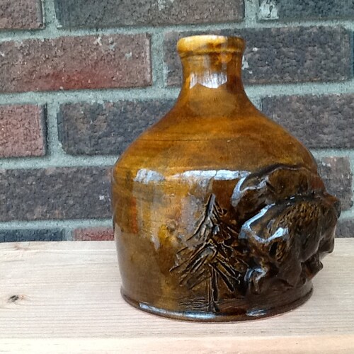 Bar gift Jugs. Bottle Bear in pine woods. glazed ceramic. potter's wheel. outlets Made in the USA by Jersey Potter, New Jersey.