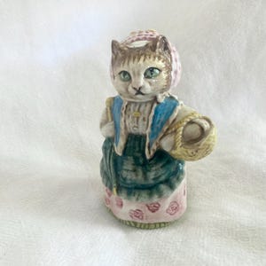 May include: A set of three ceramic nesting bowls in shades of blue, green, and white. The bowls feature a speckled glaze and a simple, modern design. The largest bowl is approximately 6 inches in diameter.