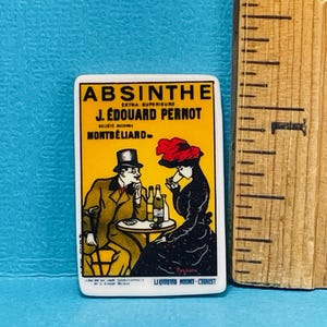 May include: A vintage advertisement for J. Edouard Pernod Absinthe, featuring two people sitting at a table with bottles of absinthe. The text on the advertisement reads "Absinthe Extra Superieur J. Edouard Pernod  Societe Anonyme Montbeliard."