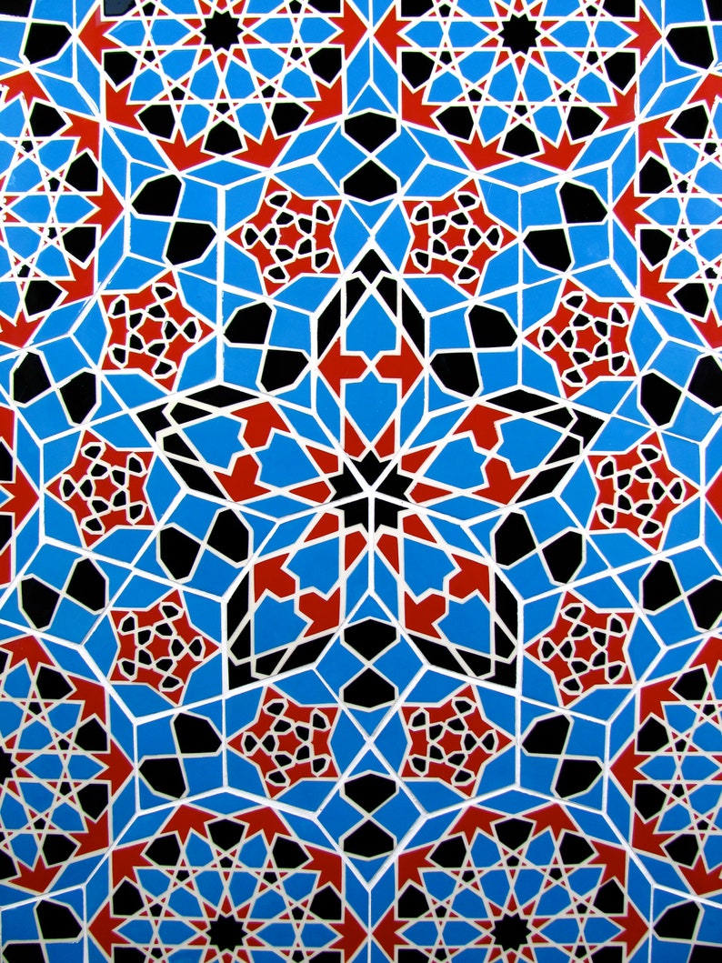 May include: A vibrant, geometric pattern featuring a repeating design of blue, red, black, and white shapes. The intricate pattern includes star-like and angular elements, creating a visually complex and symmetrical composition. The design is reminiscent of mosaic or tile work.