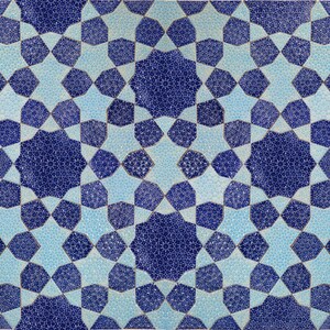 May include: Geometric pattern in shades of blue and light blue. The design features a repeating pattern of stars and octagons, creating a symmetrical and visually appealing mosaic. The intricate details and color palette give it a classic, timeless feel.