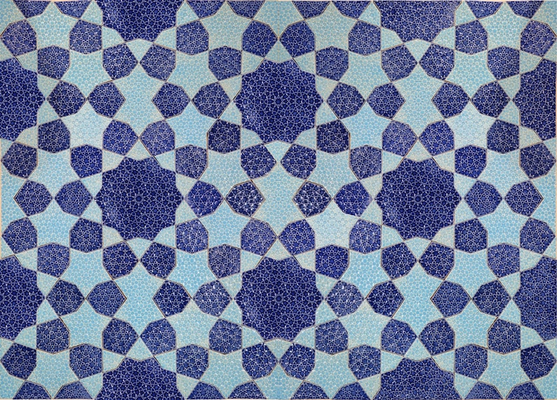 May include: Geometric pattern in shades of blue and light blue. The design features a repeating pattern of stars and octagons, creating a symmetrical and visually appealing mosaic. The intricate details and color palette give it a classic, timeless feel.