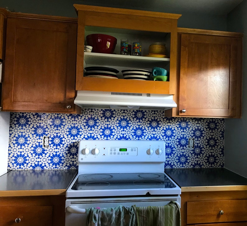 blue and white ceramic tile backsplash