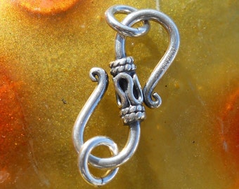 Medium Sterling Silver S-Clasp, CL56 is double sided with a wavy pattern, 25 mm x 8 mm, Just under 1 inch long and 1/3 inch wide