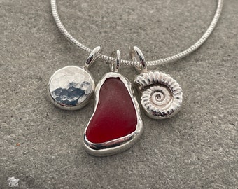 Handmade Red natural sea glass necklace with silver pebble and ammonite
