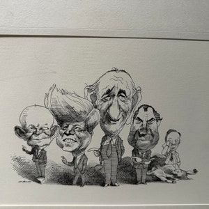 May include: Black and white caricature drawing of five men. The men are drawn in a humorous style with exaggerated features. The drawing is framed and matted.