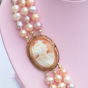 Antique Hand Carved shell Camee between a 3 rows hand knotted freshwater pearls in white and pink pastel shades